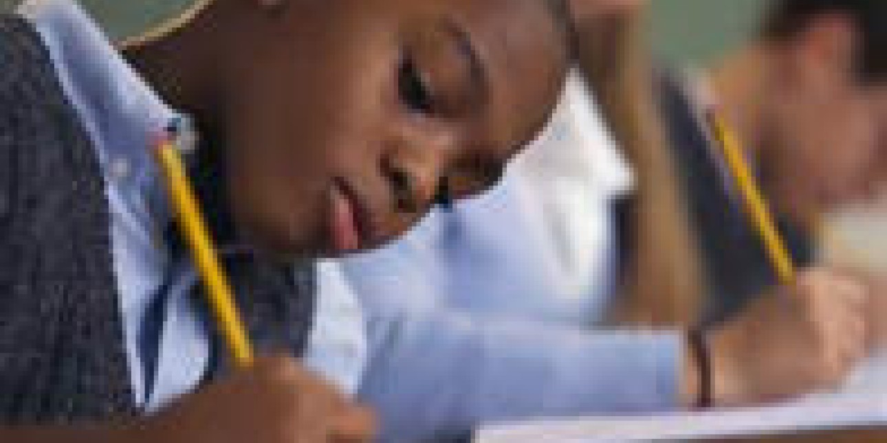 Children taking notes in class