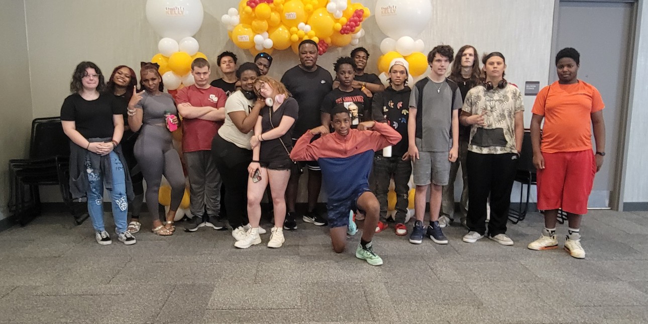 Group pic of our Founder, Joe Kelly and a group pf teens from the Teen Summit event